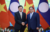 Prime Minister welcomes Lao Party General Secretary and President in Hanoi